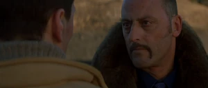 Petrovich talking to Cross about the money and power he could give him