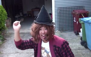 Asian Mother dressed as a witch.