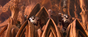 After the Jedi had taken significant losses and were trapped in the arena, Dooku ordered the droids to cease fire.