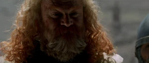 Raynald mocking Saladin by drinking from his goblet of water without permission.