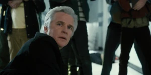 Brenner hearing a noise where he sees the monster arriving at the school through a portal.