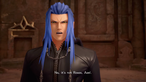 Saïx continues to attempt to jog Xion's memories by mentioning Roxas and Axel's names.