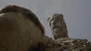Scar looking down on Mufasa