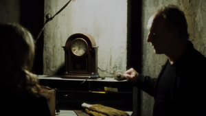 John shows Jill a 300 year old clock that still works.