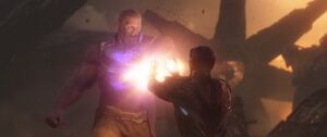 Thanos inches away from Iron Man.