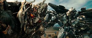 Megatron taunted by Starscream about his weakened condition.