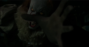 Pennywise's evil stare as it tries to kill the Losers gang.