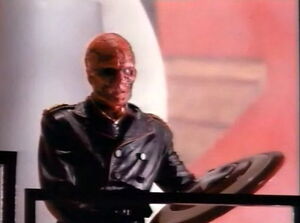 Red Skull catches Captain America's shield.