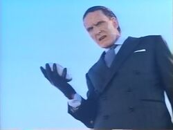 Red Skull as Tadzio de Santis, wearing human mask on his face to hide the true face of his Red Skull.