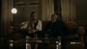 Villanelle opening champagne as Konstantin tells her about Eve Polastri's hunt for her.