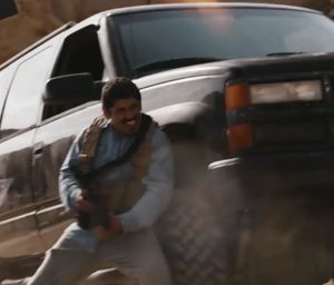 One of the mercenaries taking cover.