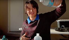 Kurt poisoning the water bottles.