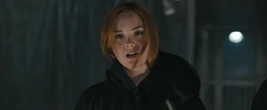 Quinn takes off her mask, revealing herself as Ghostface.