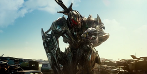 Megatron holding Starscream's head.