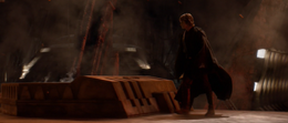 Anakin walking towards his wife on the platform.