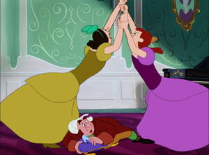 Drizella and Anastasia fighting over the glass slipper before being reprimanded by their mother.