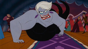 Ursula crawling towards Ariel and Eric.