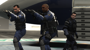 Becker and his soldiers turning to face Max.