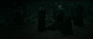 Lucius seeing Harry lying on the ground after Voldemort hits him with a Killing Curse.