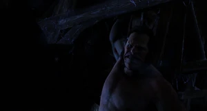 Mr. Hyde hangging from the rafter with one arm.