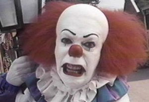 Pennywise's angry glare as it comes out of Mike's book.