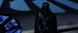 As Luke climbs onto a balcony, Vader stares daggers at him.