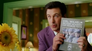 Larry trying to persuade Joan into sending Conrad to military school.