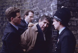 Alan is caught by the police and arrested for his crimes.