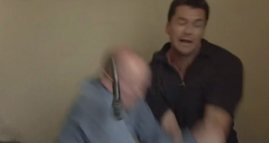 Phil disarms Dan as they fight (2001).