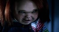 Chucky (not scarred) enjoying seeing the nanny Jill getting electrocuted