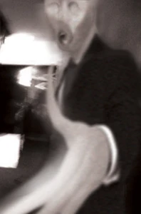 Slender Man extending his hand.