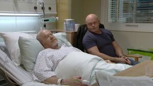 Phil is comforted by Grant in hospital.
