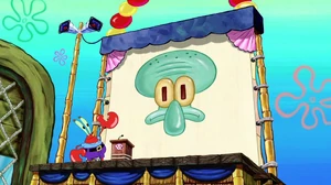 Mr. Krabs giving Squidward Tentacles the manager privilege.