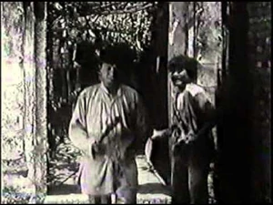 Chí Phèo about to stab Bá Kiến.
