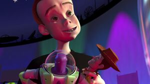 Sid holding Woody and Buzz
