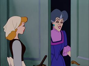 Lady Tremaine informed by Cinderella that a carriage has arrived.