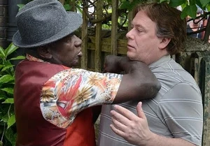 Ian Beale being threatened by local shopkeeper Patrick Trumman over the former's relationship with the latter's surrogate daughter Denise Fox.