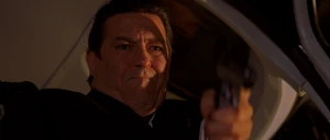 Reiss betraying one of his accomplices in his helicopter.