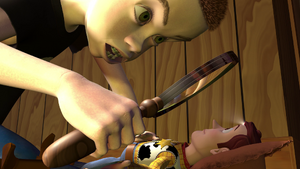 Sid burns Woody's forehead.