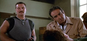 Arius and Bennett interrogating John Matrix.