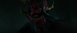 Mother Talzin taps Maul's forehead.