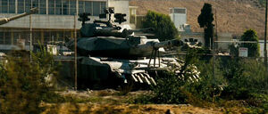 Brawl's vehicle mode in the film, an unbranded M1 Abrams "stealth" tank.