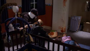 Greg feeding the baby after killing Laurie.