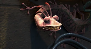 Randall growling with rage Sulley for destroying his machine, preparing to strike.