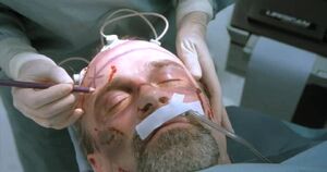 Cain's brain is removed to be used for Robocop 2.