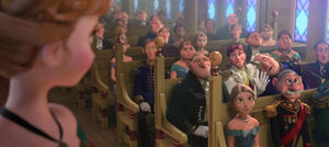 Hans awkwardly waving to Anna during her sister's coronation.