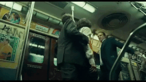 Arthur is knocked out by one of the thugs.