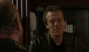 Phil Mitchell gets taunted by Dirty Den in their final showdown on Christmas Day 2003.