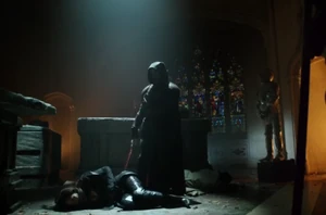 Azrael stabs his sister.