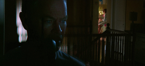 Birkin receives an alerting phone call while his wife puts his daughter to bed.
